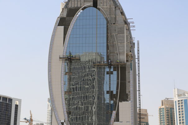 mast climbers on a building being constructed